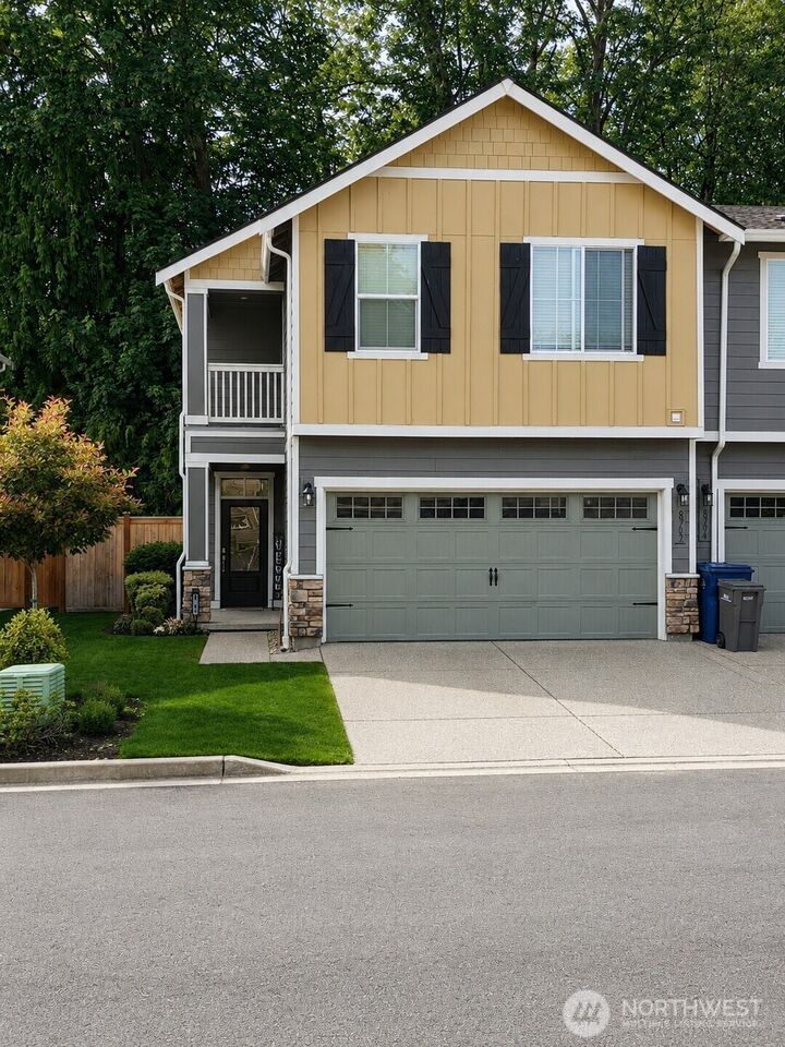 The townhome from the street at 8702 E Gilman Avenue