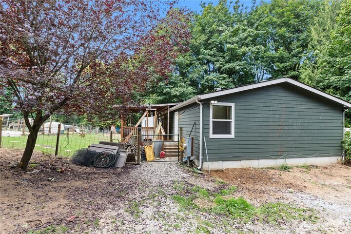 Outbuildings and cleared ground at 18010 123rd Avenue NE