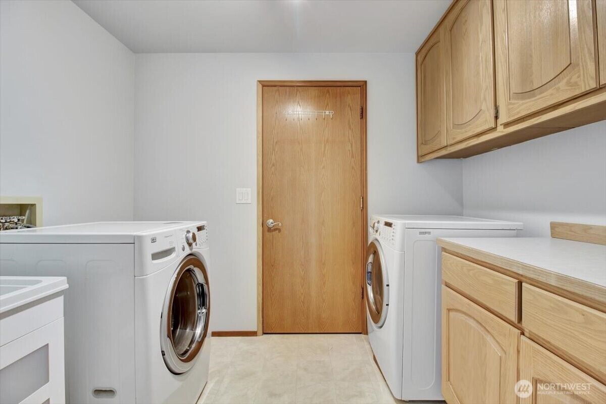 Utility room with washer and dryer