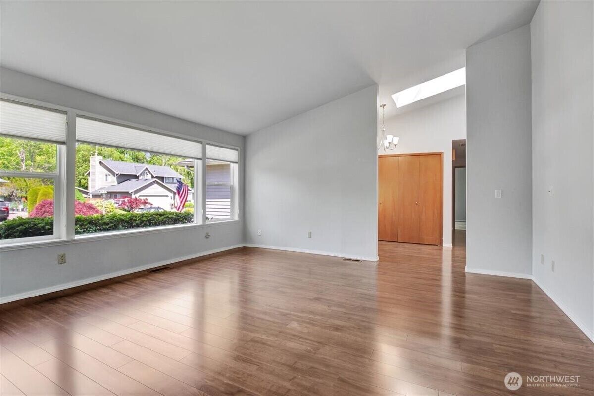 Living room with hardwood floors and a wide window