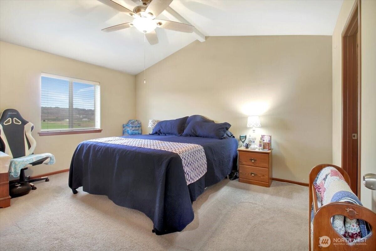 Primary bedroom with vaulted ceiling