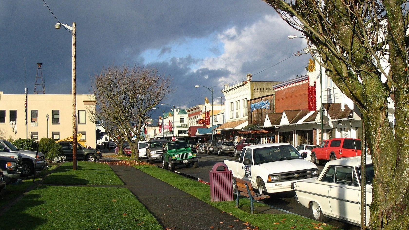 Downtown Arlington, with storefronts and parked trucks along the street